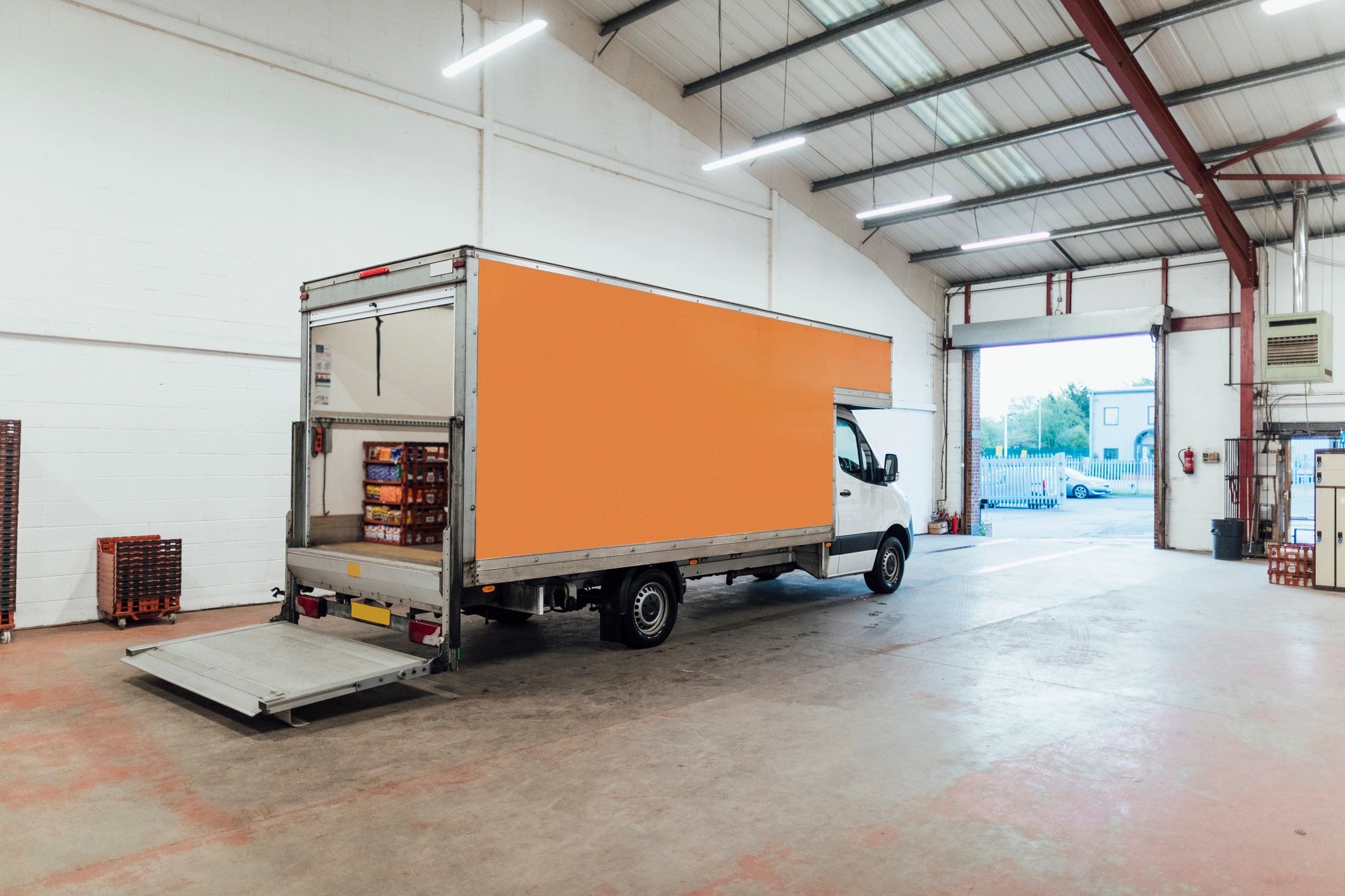 Open delivery truck at distribution warehouse