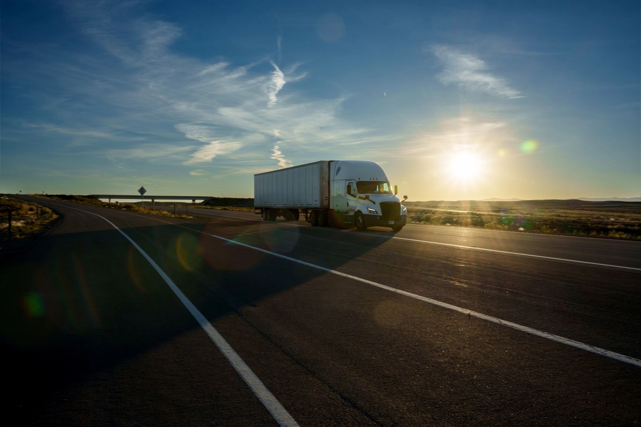 Semi-truck transporting goods on highway